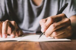 man writing his will