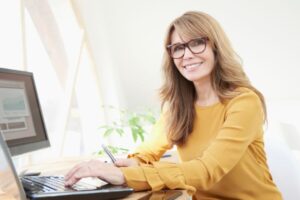 woman working on her laptop from home
