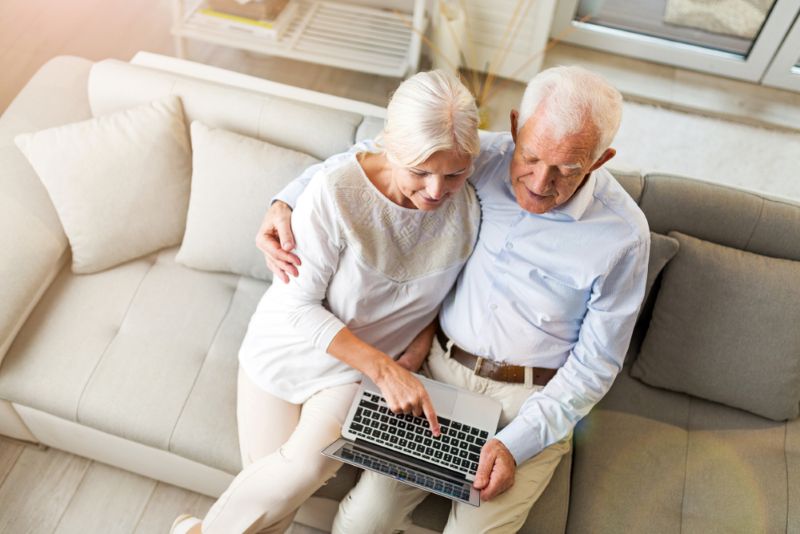 older couple updating estate plan on laptop