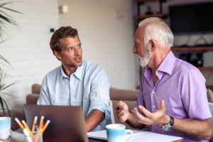 two business owners discussing their work