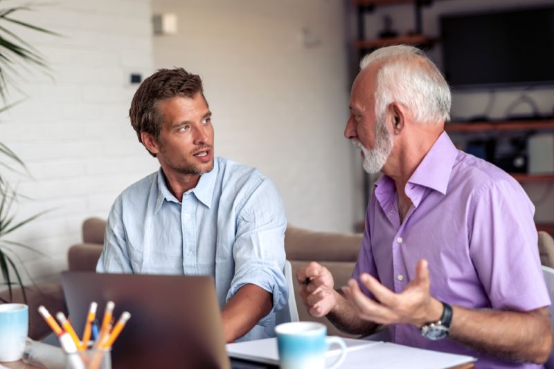 two business owners discussing their work